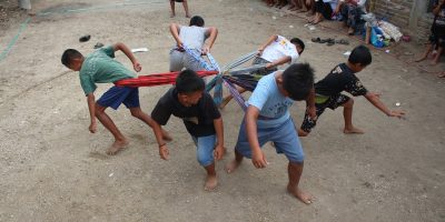 Group of Boys Playing a Game of Pulling Each Other
