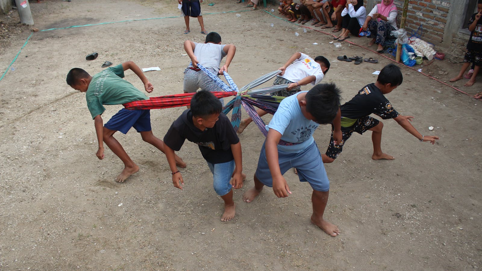 Group of Boys Playing a Game of Pulling Each Other